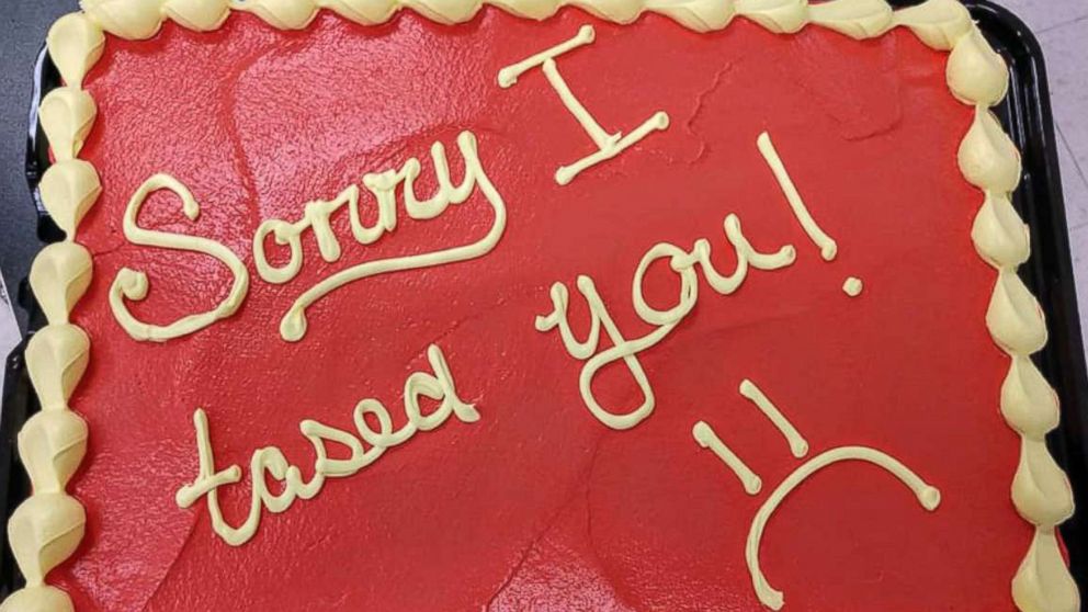 'Sorry I tased you!': Police officer apologizes to firefighter with cake