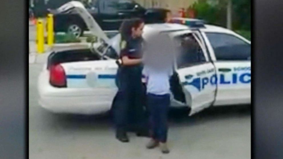 A 7-year-old boy emerged from a Miami-Dade police car's back seat on Jan. 26, 2018, in metal handcuffs while his mother videotaped and comforted him from just a few feet away.