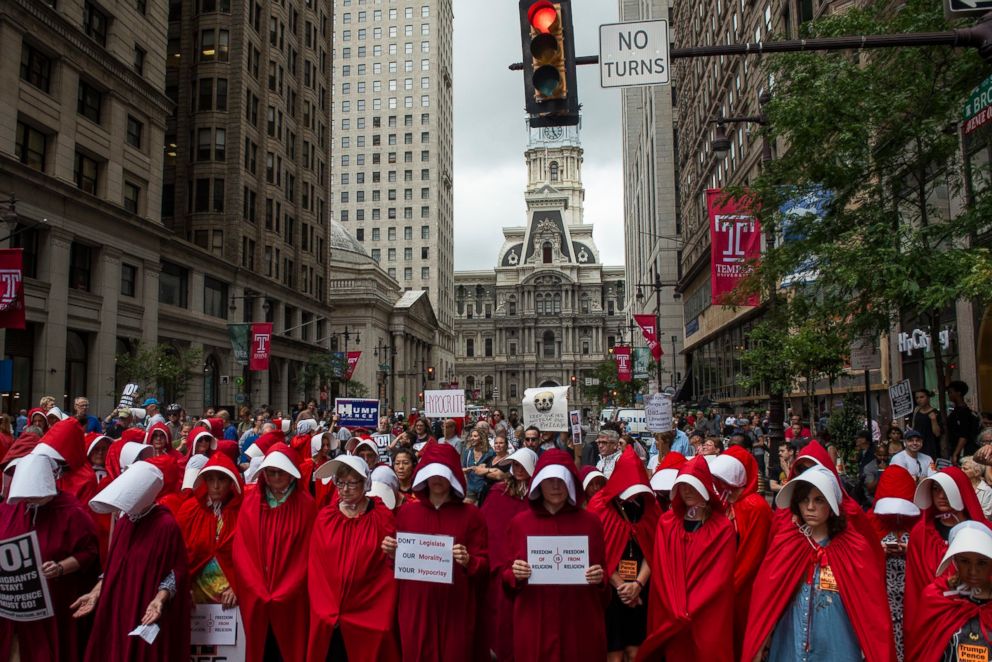 PHOTO: Demonstrators dressed as characters from the novel-turned-TV series "The Handmaid's Tale" gather outside of the Union League where Vice President Mike Pence attended a fundraiser for Rep. Lou Barletta, July 23, 2018, in Philadelphia