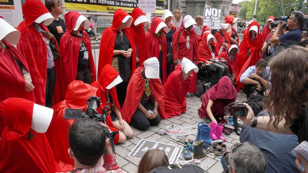 PHOTO: Women dressed dressed as characters from the novel-turned-TV series "The Handmaid's Tale" protest in front of the Alexander Hamilton Customs House, July 31, 2018, in New York City.