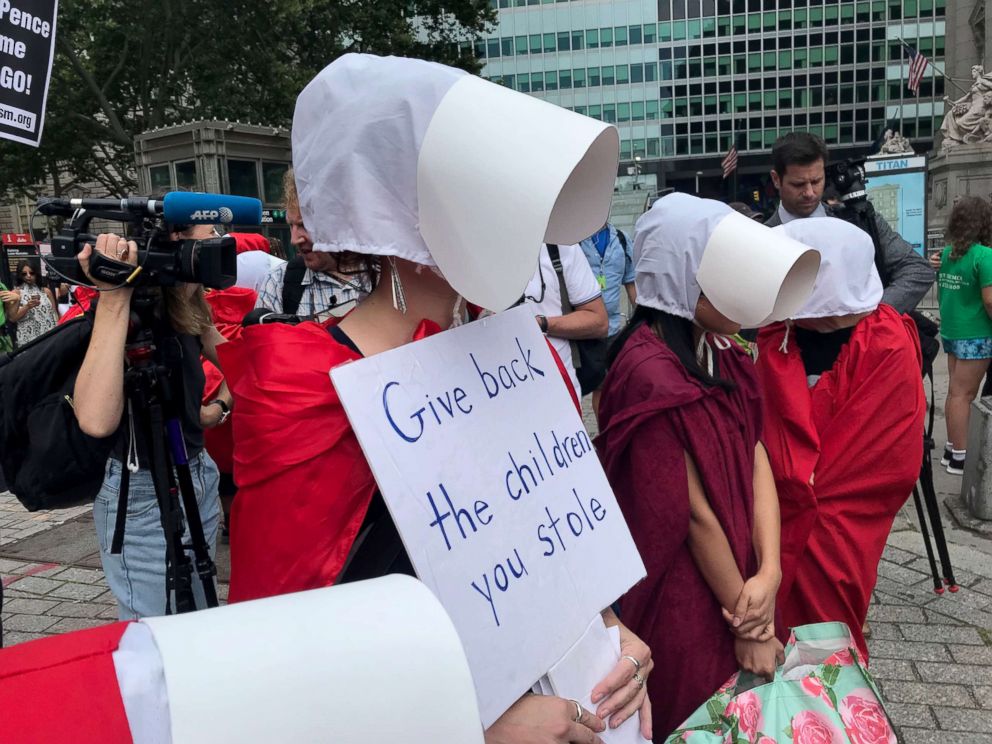 PHOTO: Women dressed in the robes of "The Handmaid's Tale" express their support for abortion rights and demand that migrant children separated from their parents be reunited during a protest in Manhattan July 31, 2018.