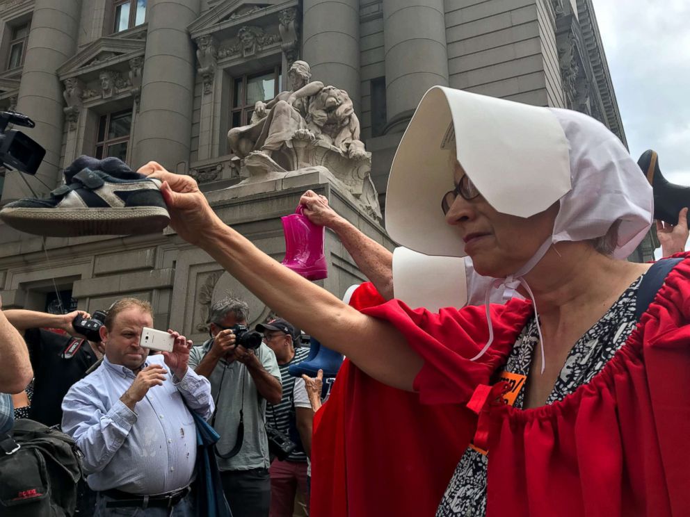 PHOTO: Women dressed in the robes of "The Handmaid's Tale" express their support for abortion rights and demand that migrant children separated from their parents be reunited during a protest in Manhattan July 31, 2018.