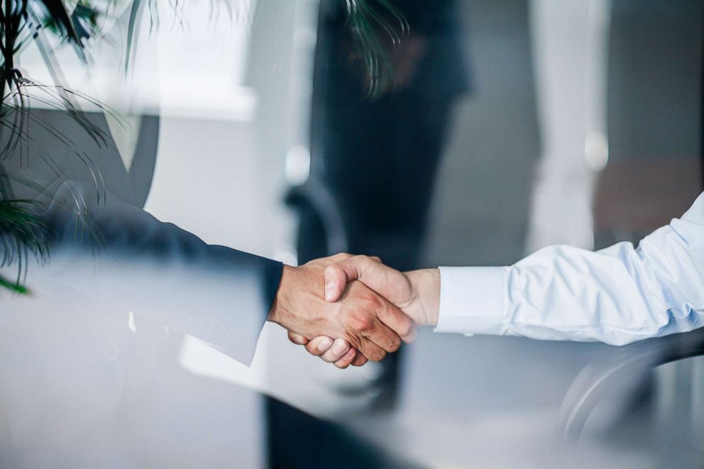 PHOTO: Two business associates shake hands.