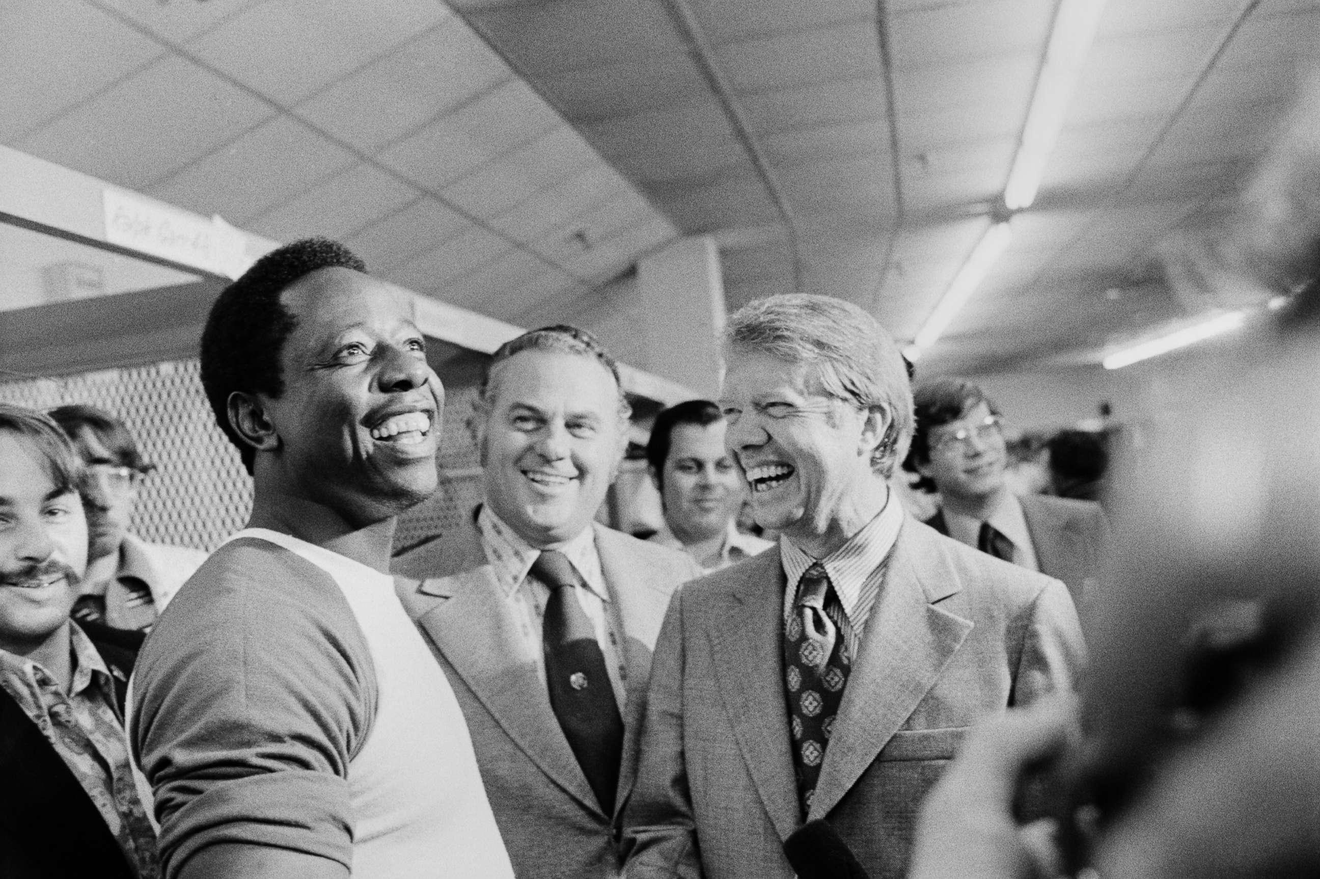 PHOTO: Governors Jimmy Carter, right, of Georgia and Sherman Tribbitt, center, of Delaware, draw a big laugh from Braves' slugger Hank Aaron as they visit him in the clubhouse after the Braves' rained out bout with the Dodgers, Sept. 27, 1973.