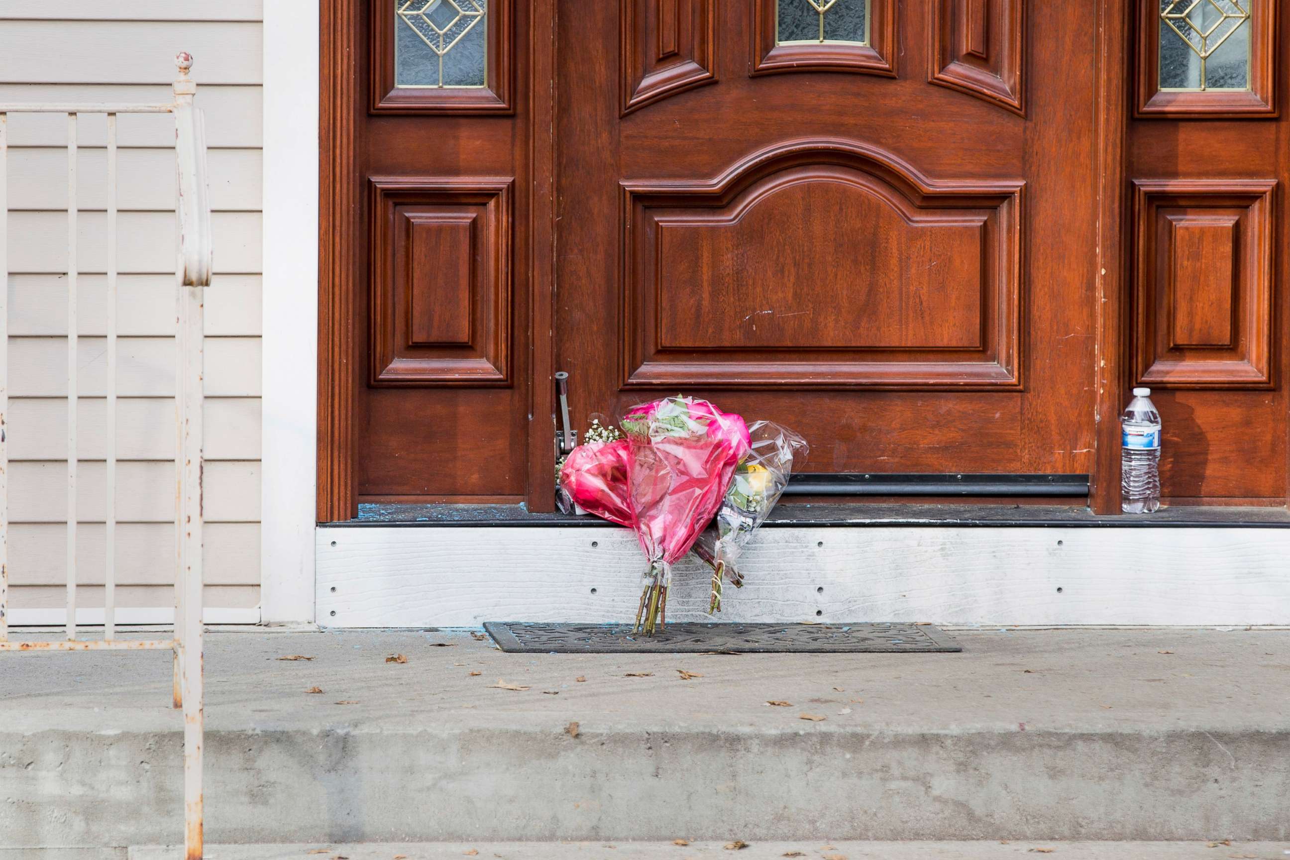 PHOTO: Flower bouquets rest on the doorstep of a rabbi's residence in Monsey, N.Y., Dec. 29, 2019, following a stabbing the previous night during a Hannukah celebration.
