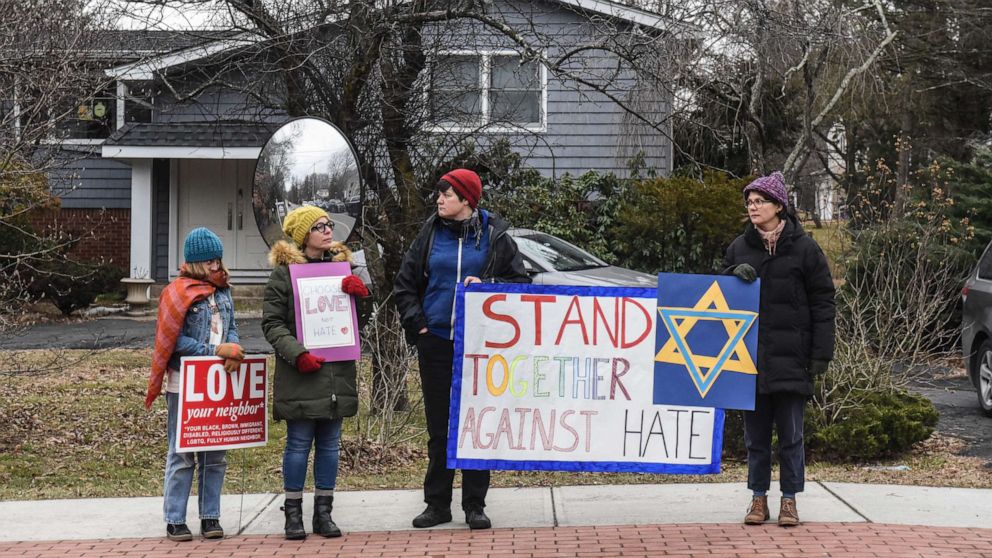 PHOTO: People hold signs of support near the house of Rabbi Chaim Rottenberg on Dec. 29, 2019, in Monsey, N.Y. Five people were injured in a knife attack during a Hanukkah party and a suspect, identified as Grafton E. Thomas, was later arrested in Harlem.