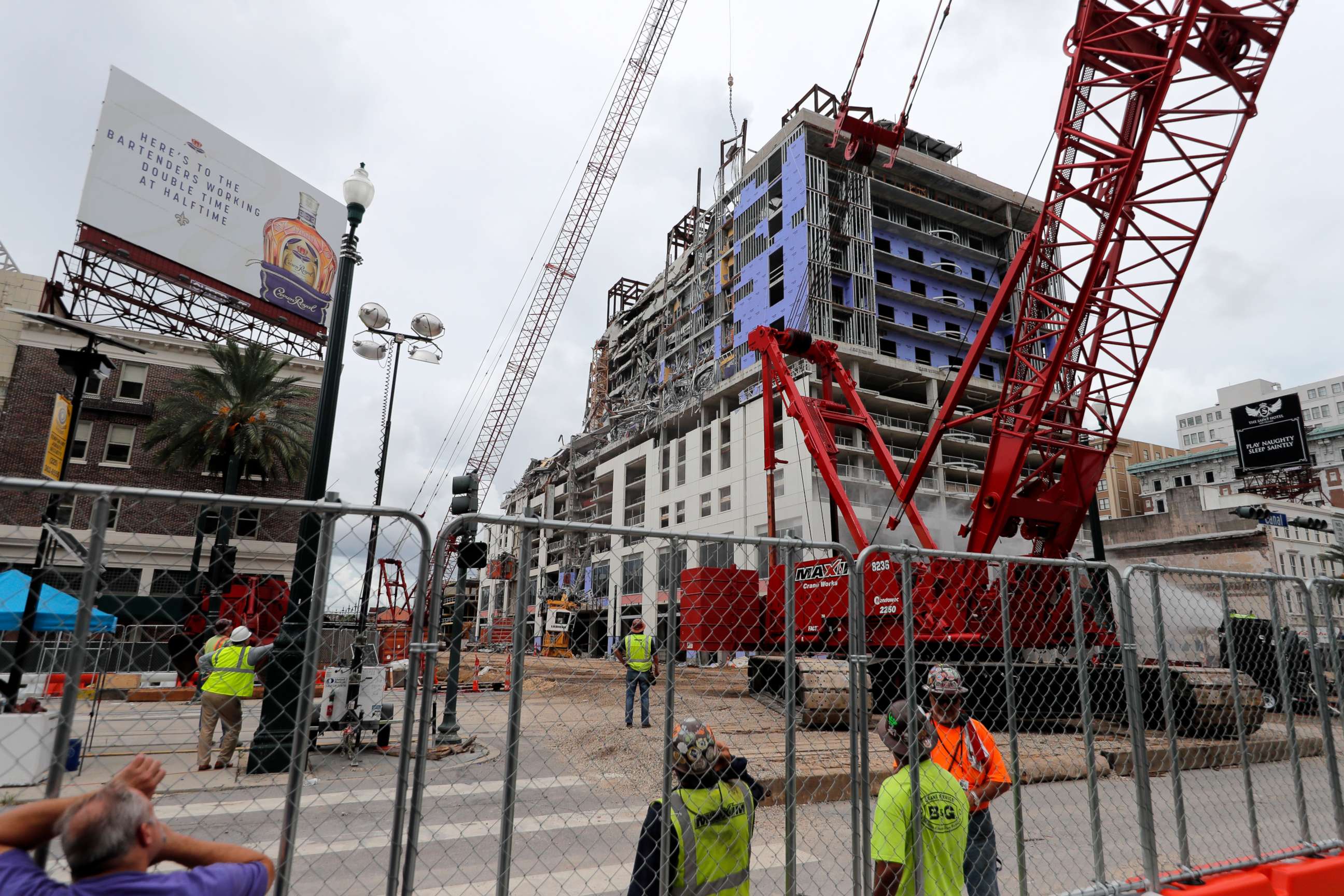 PHOTO: Workers watch as a wrecking ball knocks debris loose from the Hard Rock Hotel building collapse site in New Orleans, Monday, July 20, 2020.