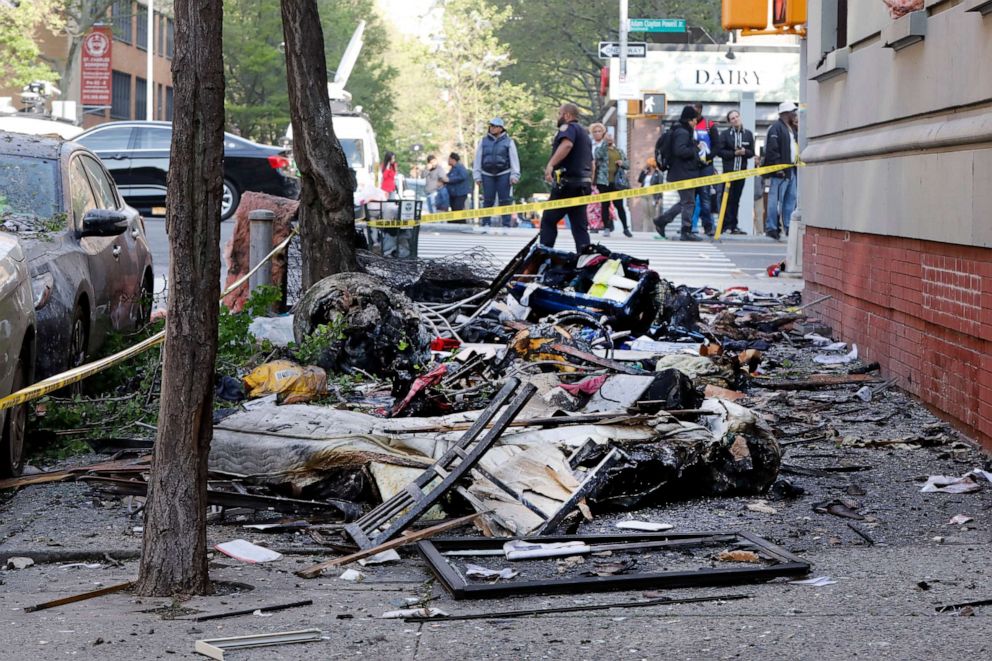 PHOTO: Debris from a building fire litters a sidewalk in New York's Harlem neighborhood, Wednesday, May 8, 2019.