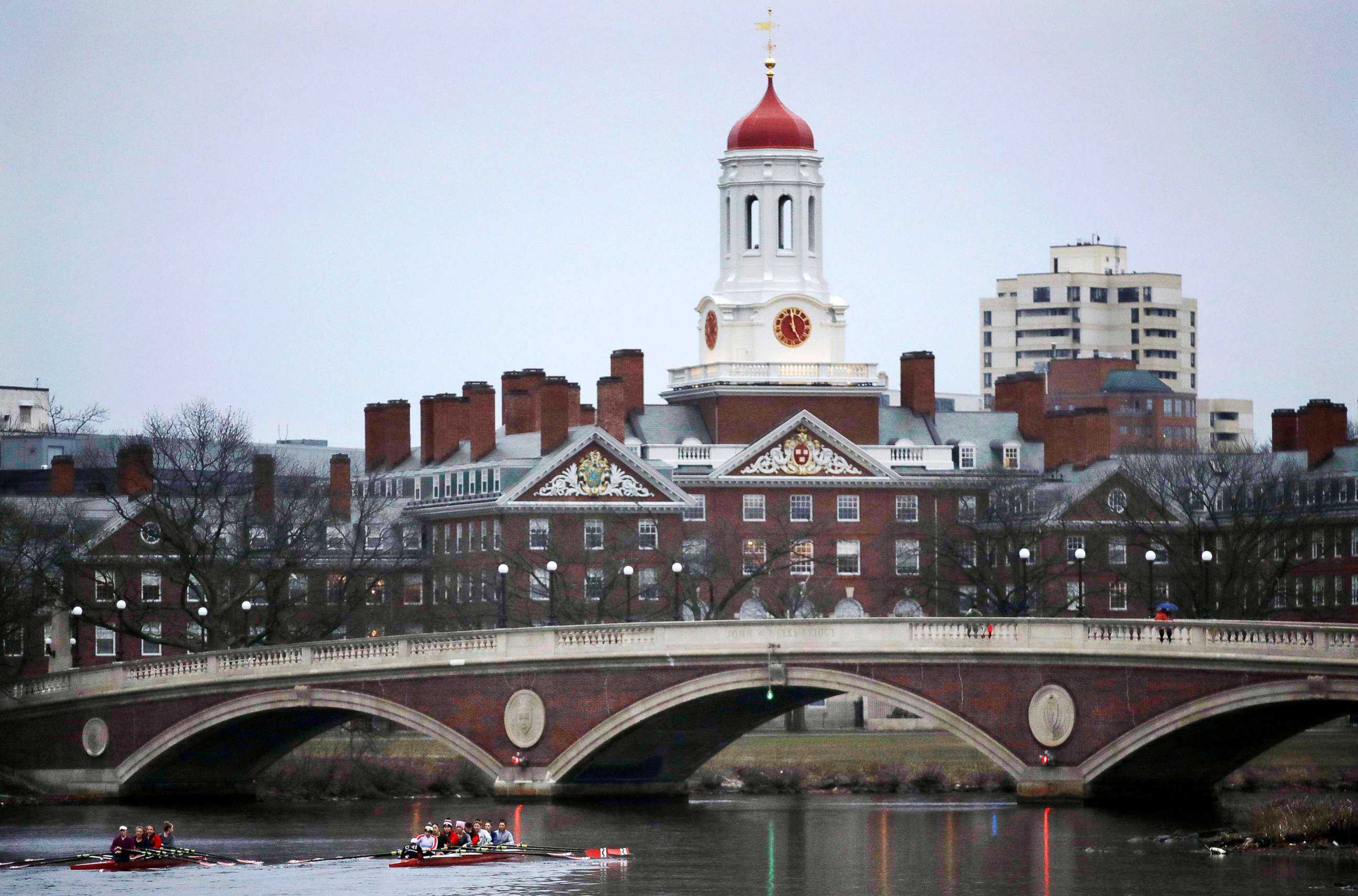 PHOTO: Rowers paddle along the Charles River past the Harvard University campus in Cambridge, Mass., March 7, 2017.