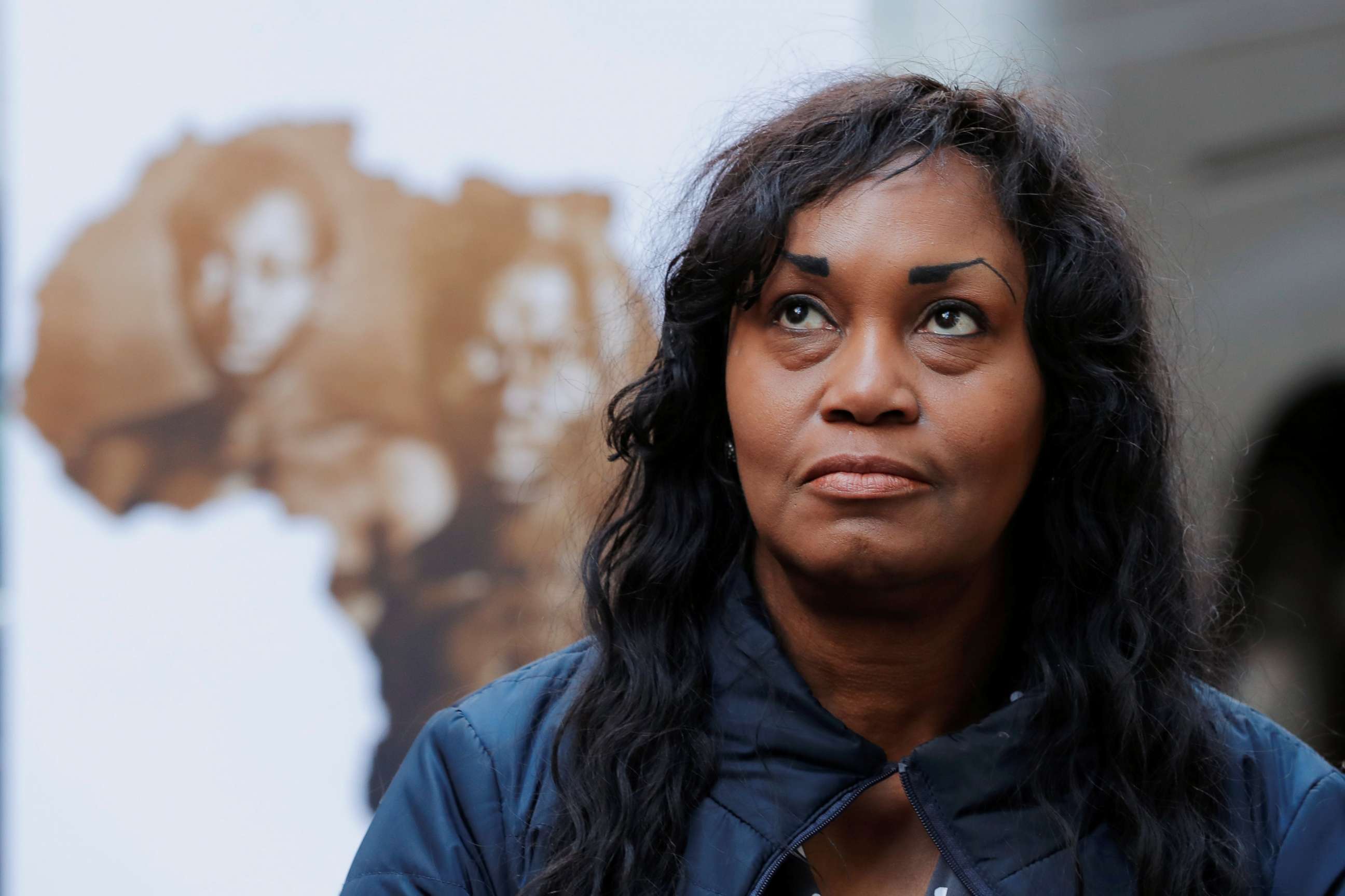PHOTO: Tamara Lanier listens as her lawyer speaks to the media about a lawsuit accusing Harvard University of the monetization of photographic images of her great-great-great grandfather, in New York, March 20, 2019.