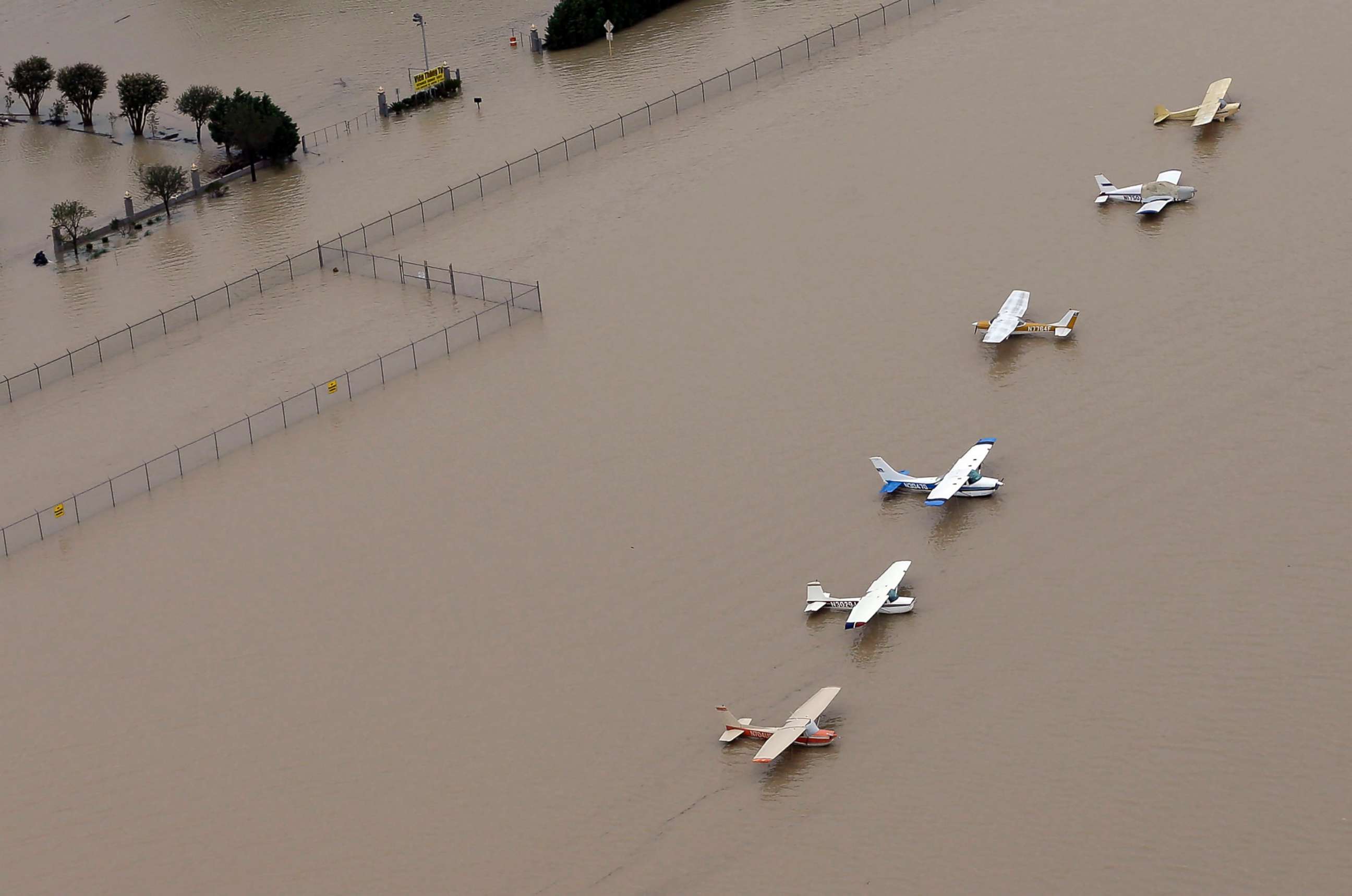 PHOTO: Airplanes sit at a flooded airport near the Addicks Reservoir as floodwaters from Tropical Storm Harvey rise, Aug. 29, 2017, in Houston, Texas.