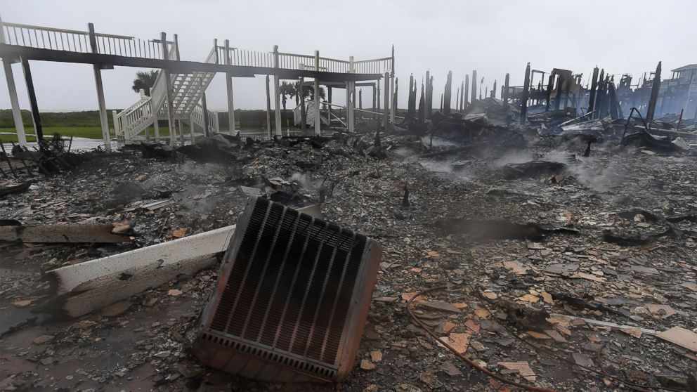 PHOTO: Debris from the charred remains of three Bolivar, Texas, beach cabins, destroyed by a fire that broke out when Hurricane Harvey made landfall, lies on the ground, Aug. 26, 2017.