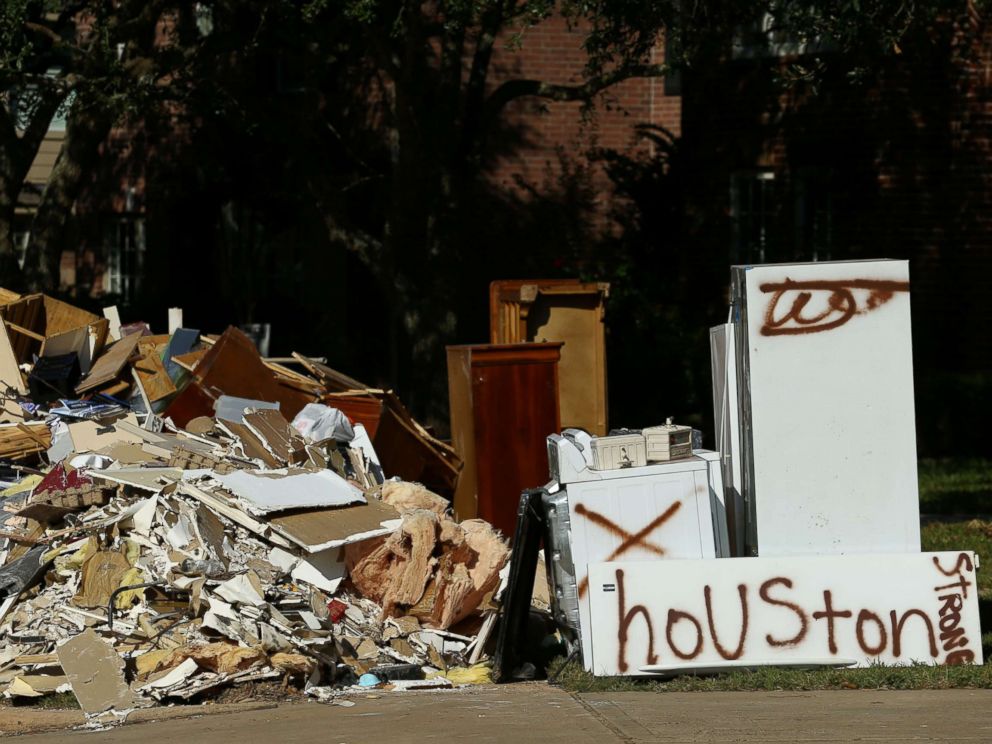 PHOTO: Flood-damaged contents from homes line the roads along residential streets in the aftermath of Harvey on the west side of Houston, Sept. 7, 2017.