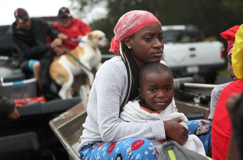 PHOTO: Evacuees wait to be transported to a shelter after being rescued from the flooding of Hurricane Harvey, Aug. 30, 2017 in Port Arthur, Texas. 