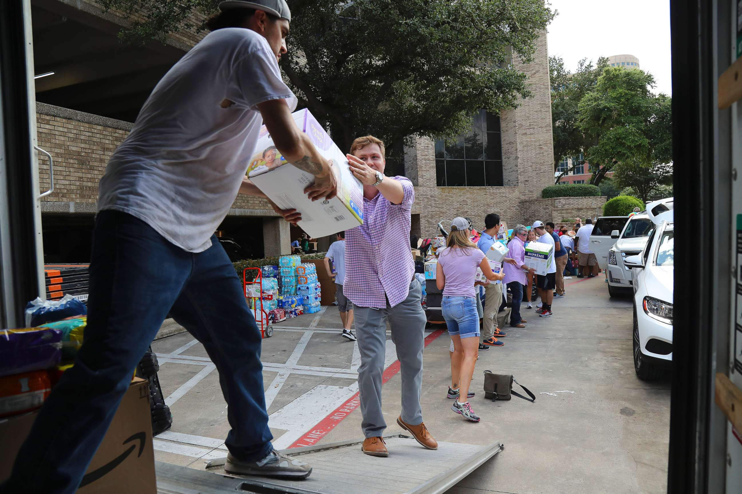 PHOTO: Volunteers stack diapers donated for  disaster relief in a truck in Dallas, Aug. 29, 2017.