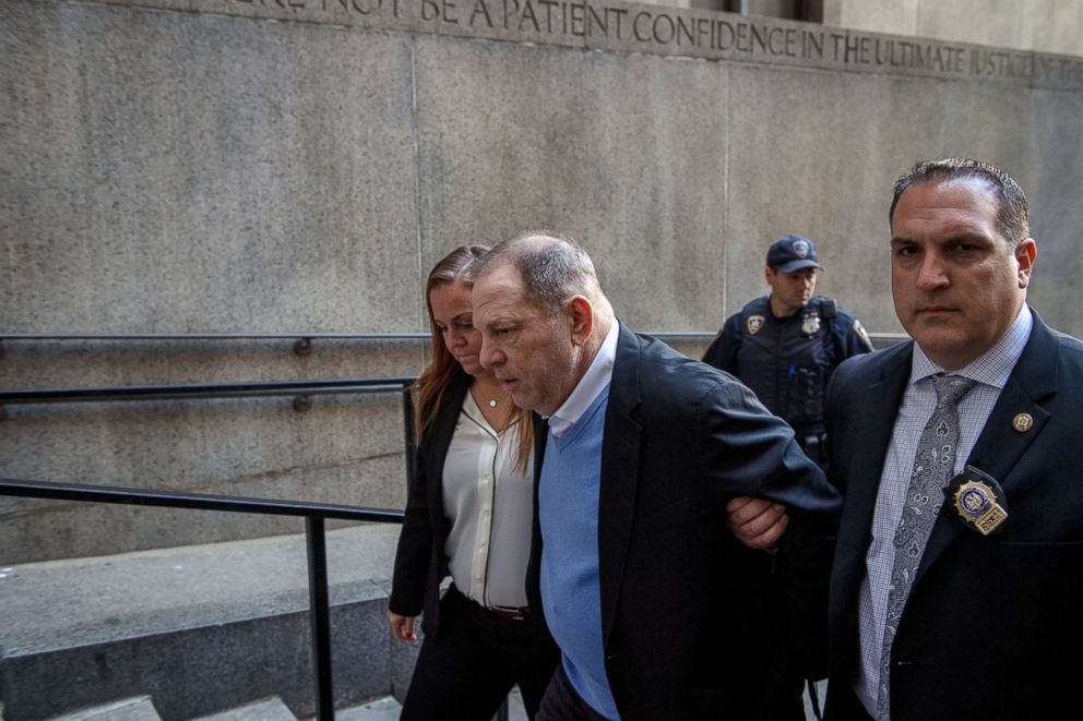 PHOTO: A handcuffed Harvey Weinstein is led into criminal court in lower Manhattan for arraignment on May 25, 2018.