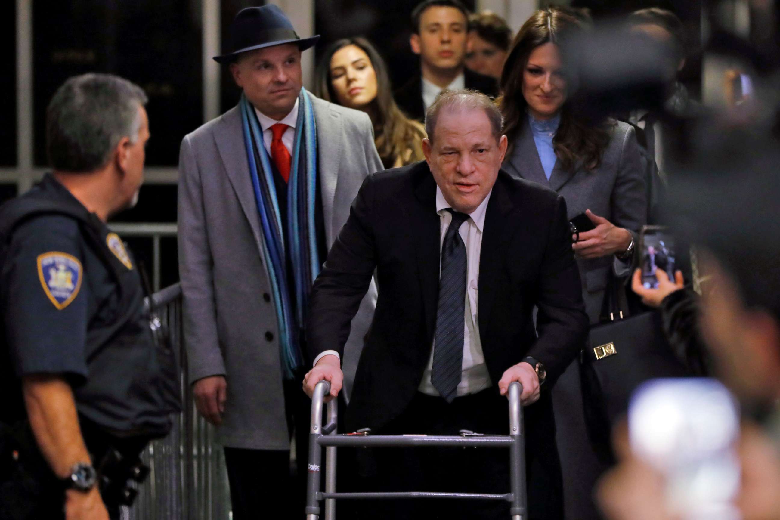PHOTO: Harvey Weinstein leaves court in his rape trial, in New York, Wednesday, Jan. 22, 2020. Two of his attorneys, Arthur Aidala, and Donna Rotunno, are background left and background right.