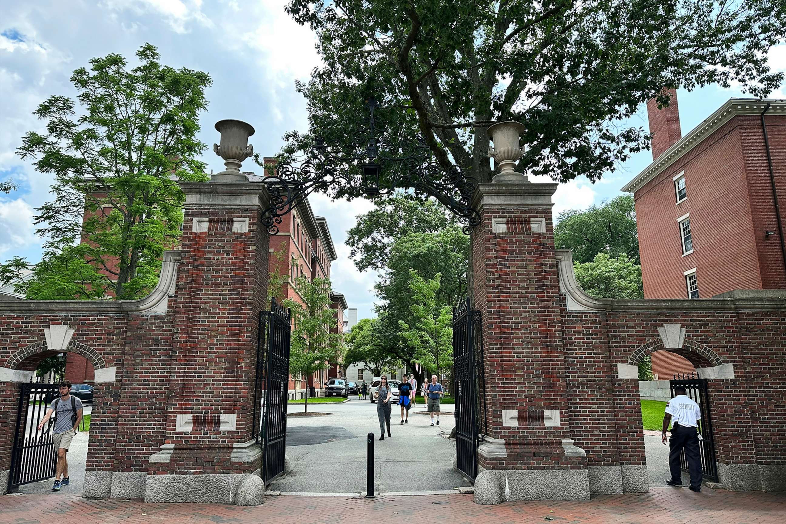 PHOTO: Students walk through a gate at Harvard University, June 29, 2023, in Cambridge, Mass.