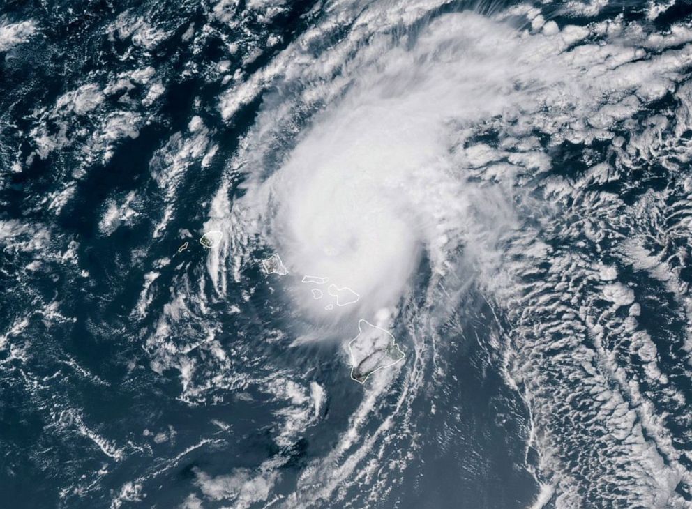 PHOTO: A handout satellite image made available by the National Oceanic and Atmospheric Administration (NOAA) shows Hurricane Douglas moving toward the west-northwest of Hawaii, July 26, 2020.