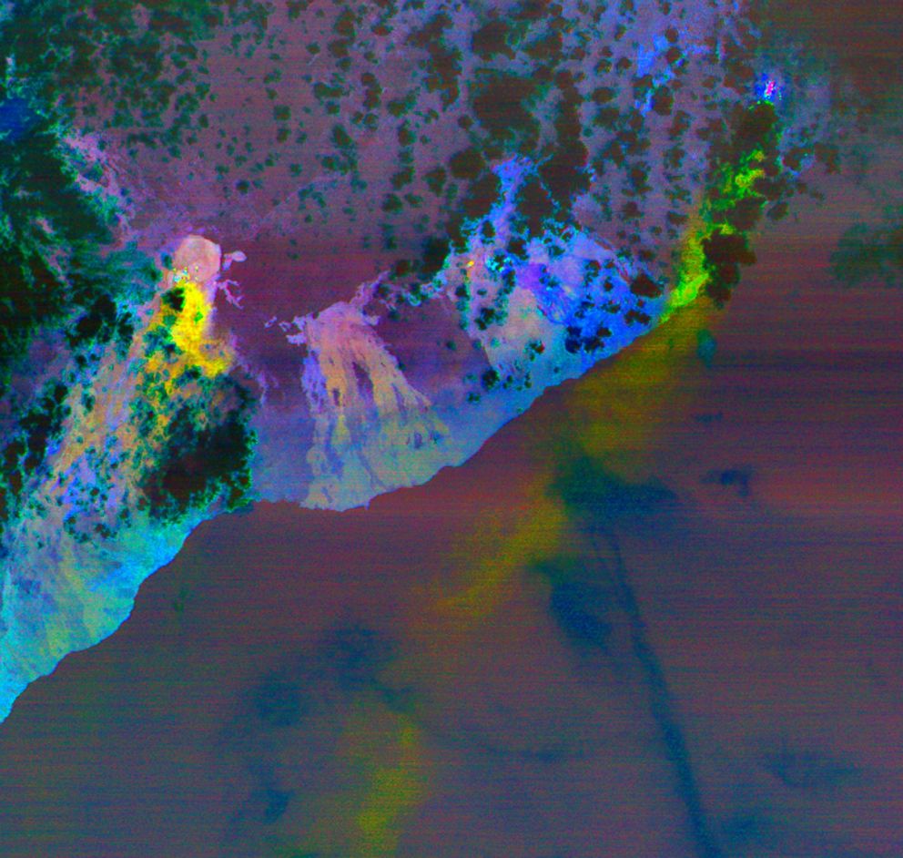 PHOTO: This image taken NASA's Terra satellite shows new fissures with long yellow streaks being plumes of sulphur dioxide gas, during eruptions of the Kilauea volcano on the island of Hawaii, May 6, 2018. 