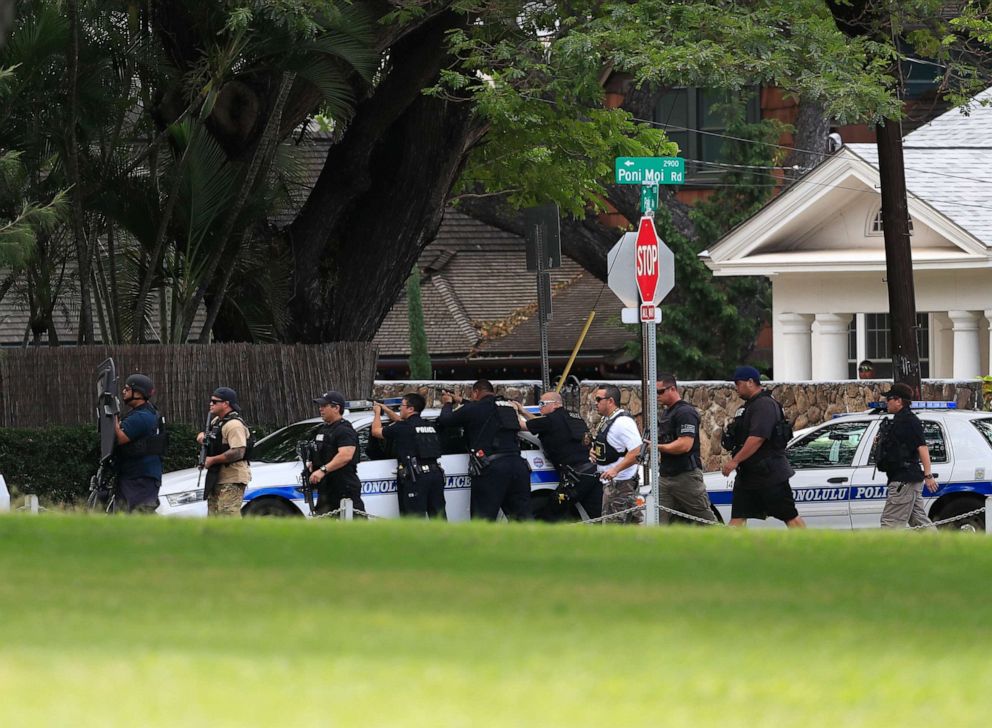 PHOTO: Honolulu police take up defensive positions with their weapons after a shooting and domestic incident at a residence on Hibiscus Road near Diamond Head, Jan. 19, 2020, in Honolulu. 