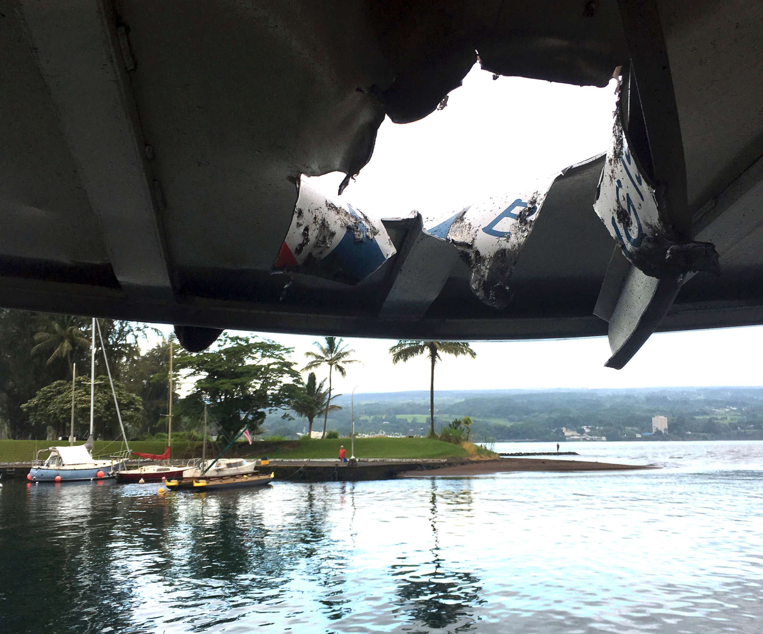 PHOTO: This photo provided by the Hawaii Department of Land and Natural Resources shows damage to the roof of a tour boat after an explosion sent lava flying through the roof off the Big Island of Hawaii on July 16, 2018, injuring at least 23 people.