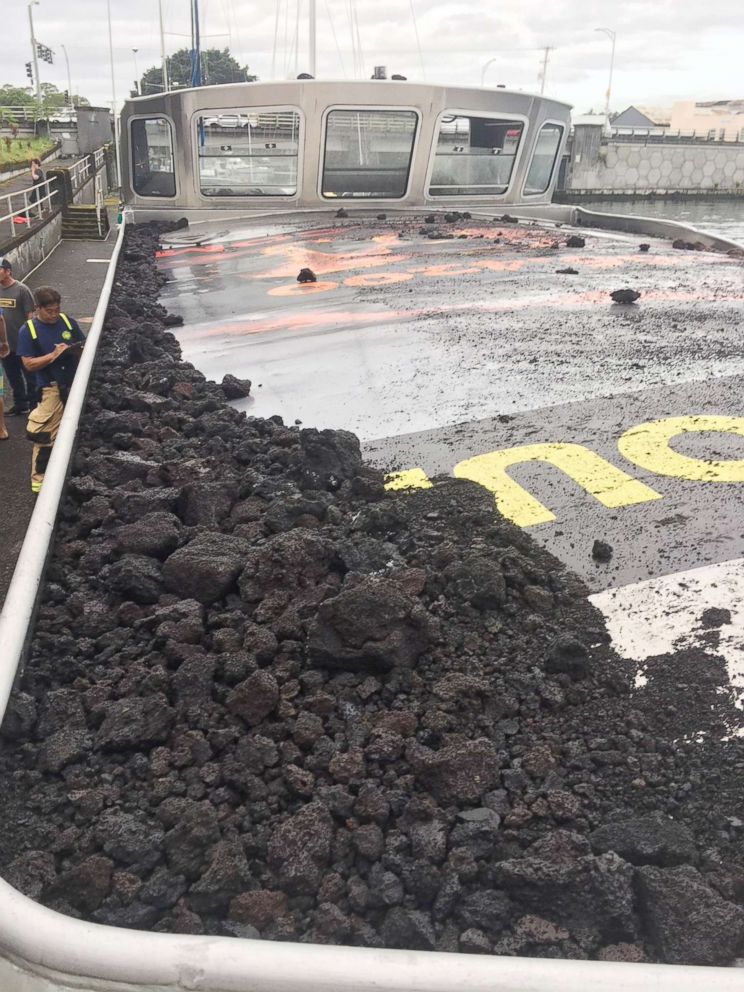 PHOTO: A handout photo made available by the Hawaii Department of Land and Natural Resources (DLNR) shows Lava on top of the Boat Tour vessel after it was hit by a 'lava bomb', July, 16, 2018.