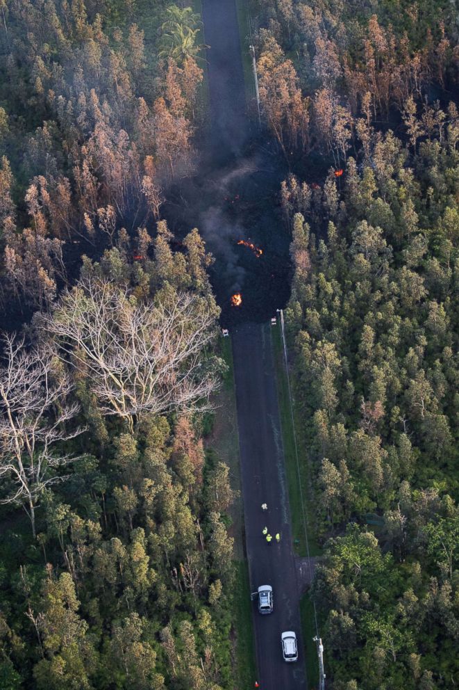 PHOTO: Mohala Street is covered by the lava flow as it makes its way downhill following the eruption of the Kilauea Volcano in Hawaii, May 4, 2018.