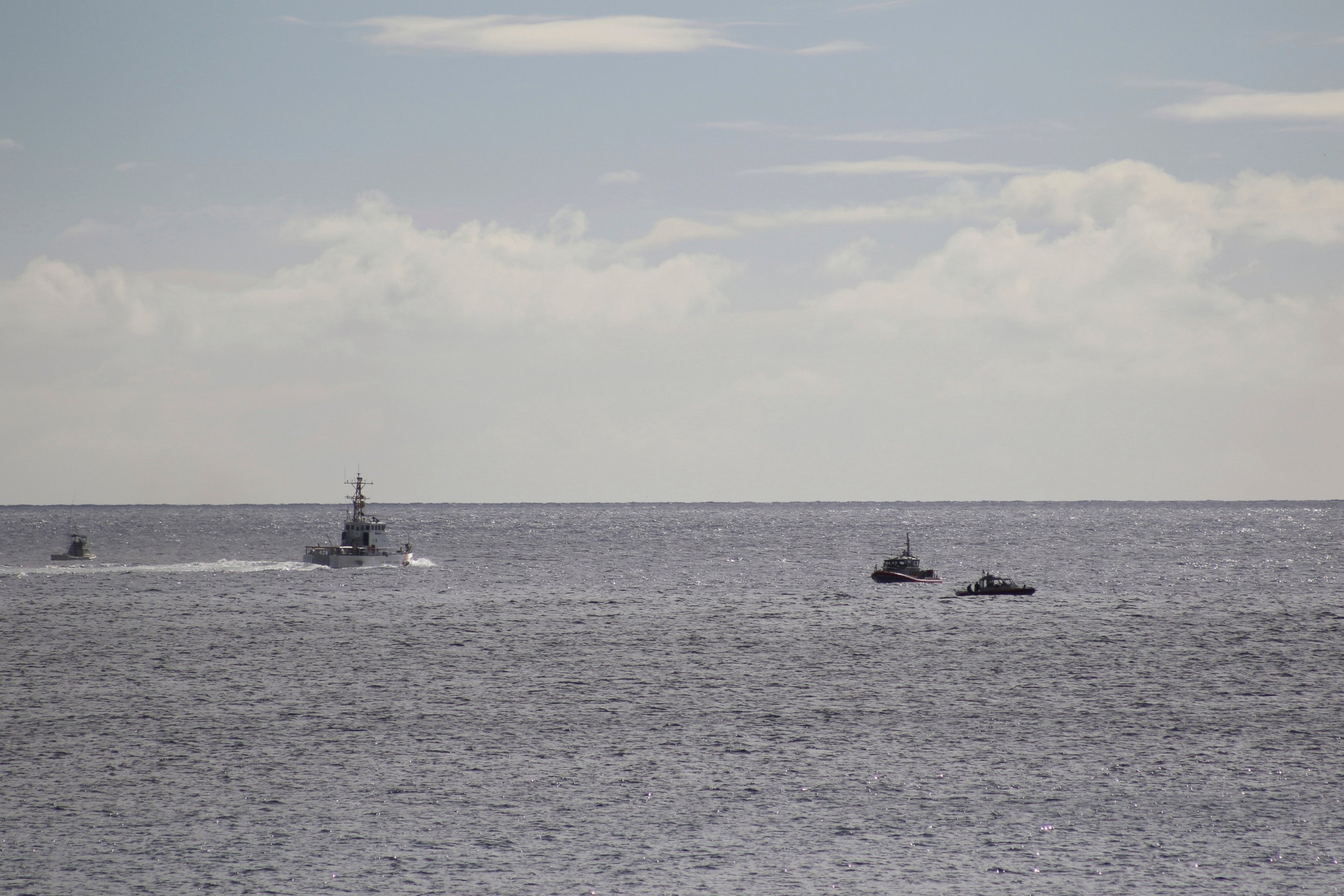 PHOTO: A U.S. Coast Guard vessel and other rescue boats respond to a plane crash off Honolulu, Wednesday, Dec. 12, 2018. Federal Aviation Administration spokesman Ian Gregor said a Hawker Hunter jet went down in the ocean around 2:25 p.m.