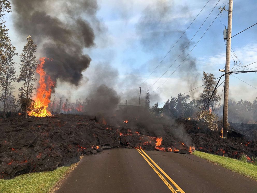 PHOTO: Lava from a fissure slowly advances to the northeast on Hookapu Street in Leilani Estates, Hawaii, May 5, 2018.