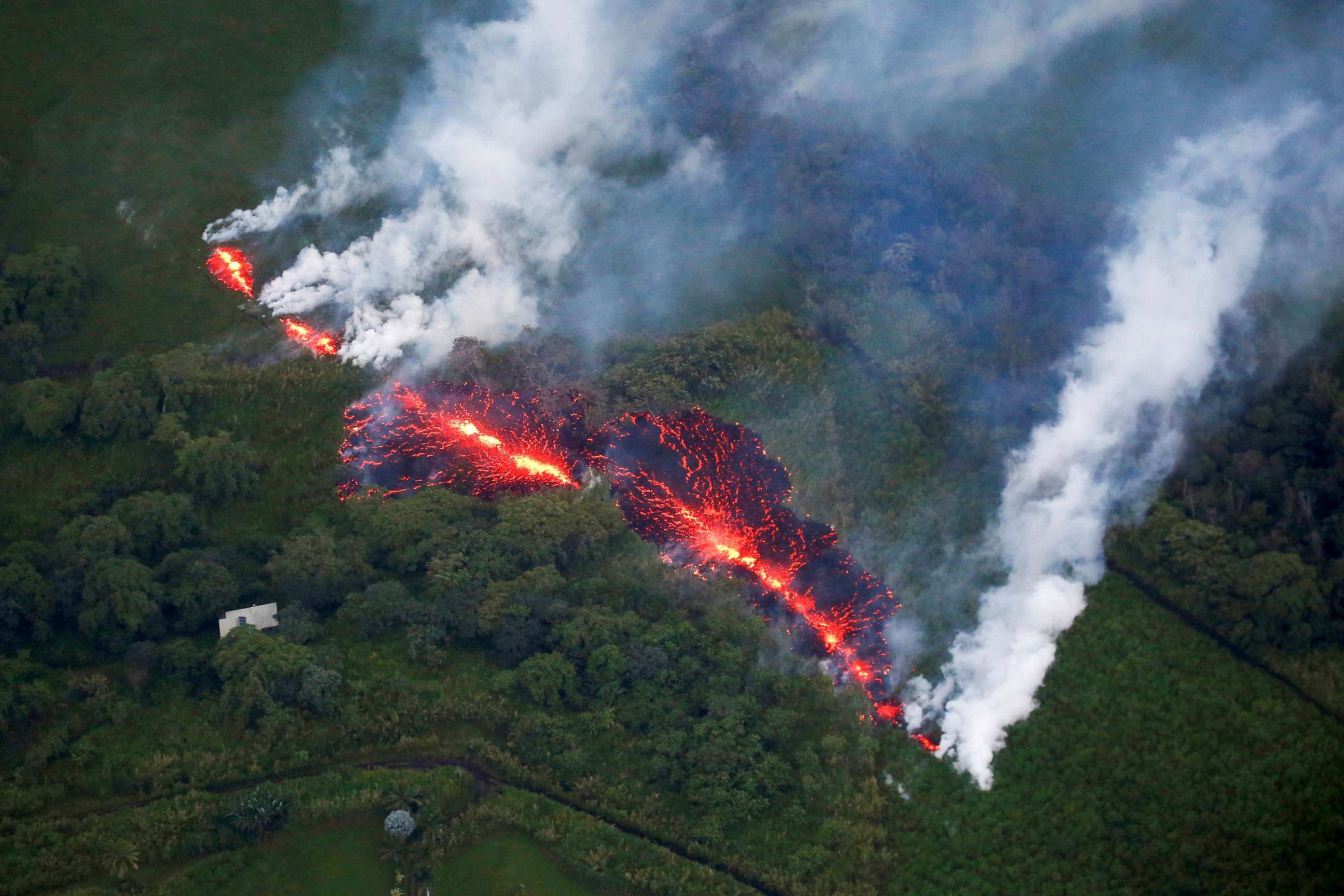 PHOTO: Lava erupts from a fissure east of the Leilani Estates subdivision during ongoing eruptions of the Kilauea Volcano in Hawaii, May 13, 2018.  