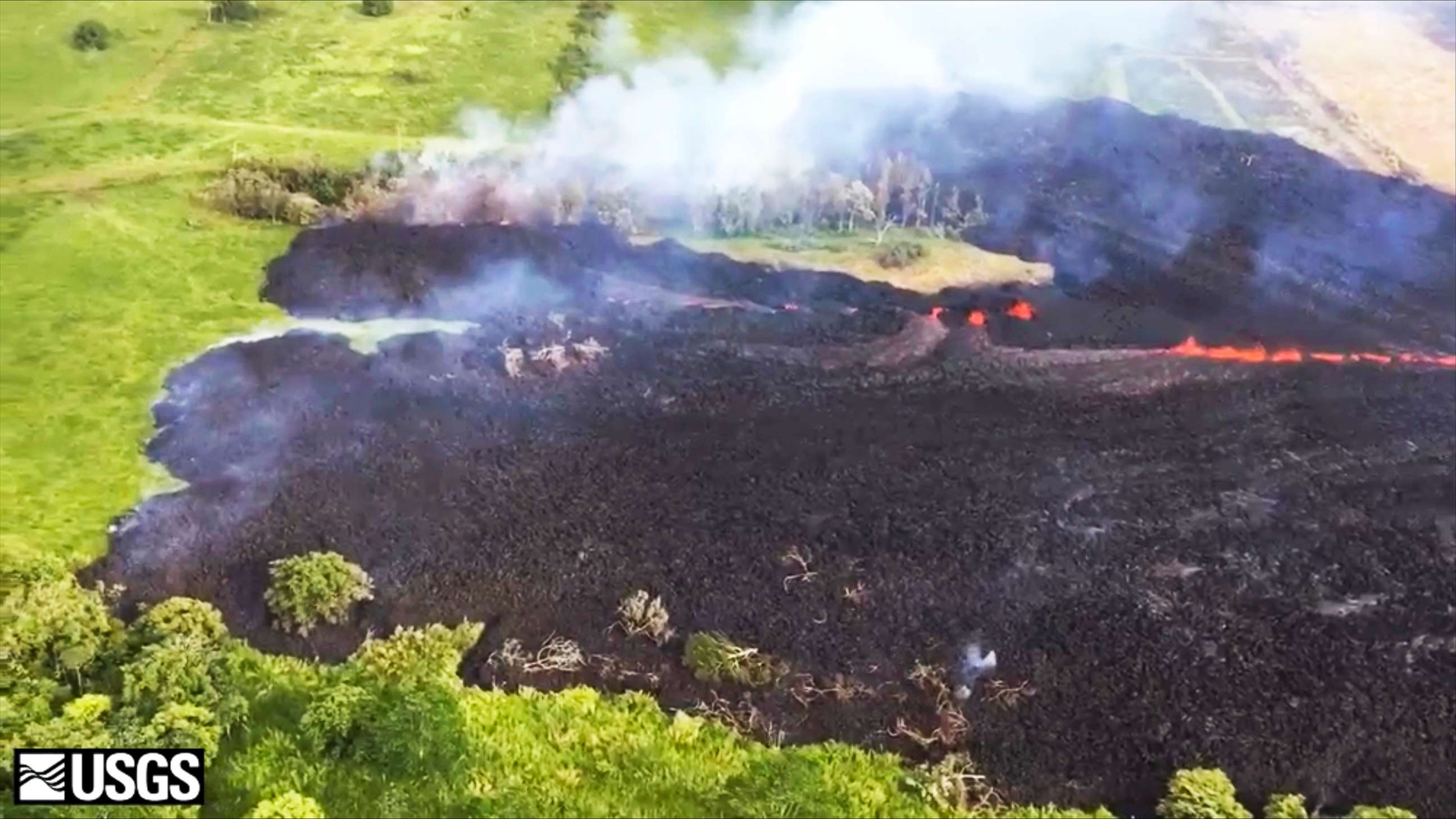 PHOTO: Gases rise from a fissure near Pahoa, Hawaii, in this May 13, 2018 frame from video released by the U.S. Geological Survey.