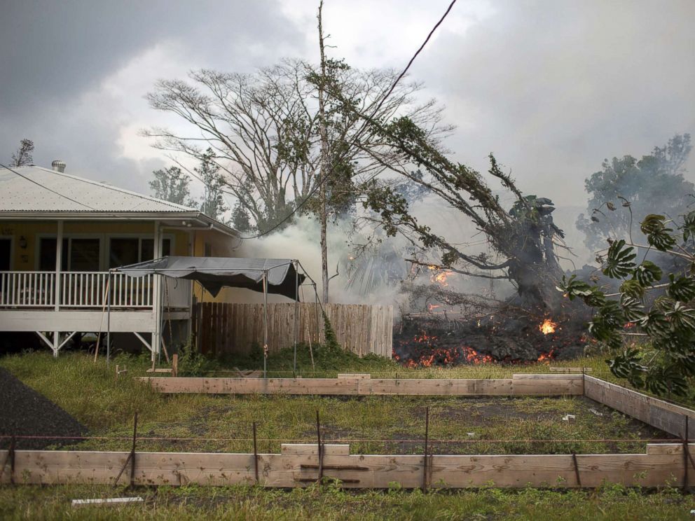 PHOTO: Lava from the Kilauea volcano advances slowly through a property in the Leilani Estates subdivision in Pahoa, Hawaii, May 25, 2018.