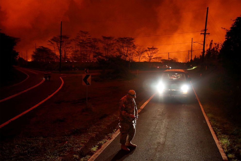 PHOTO: Major Jeff Hickman, of the Hawaii National Guard, measures sulfur dioxide gas levels at a lava flow near Pahoa during ongoing eruptions of the Kilauea Volcano in Hawaii, June 3, 2018.