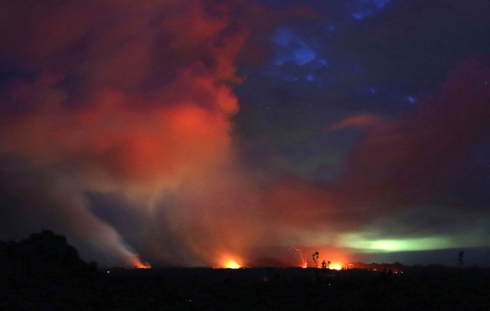 PHOTO: Lava shoots into the night sky from active fissures on the lower east rift of the Kilauea volcano, May 15, 2018, near Pahoa, Hawaii.