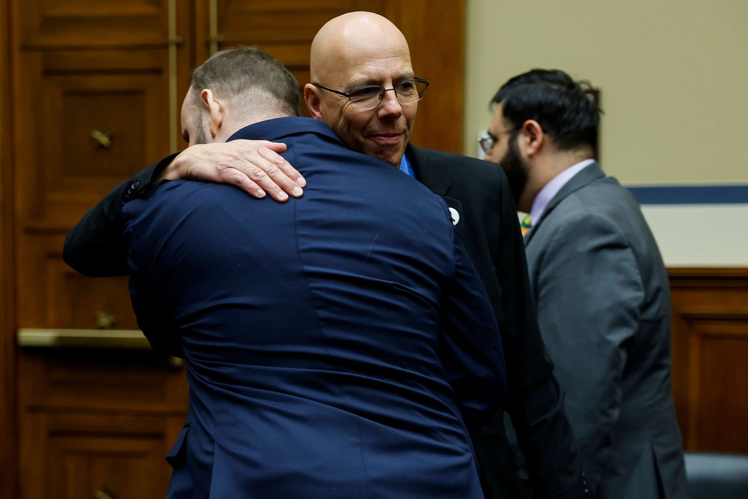 PHOTO: Matthew Haynes, the owner of Club Q hugs James Slaugh a survivor of the Club Q shooting in Colorado Springs after speaking at the House Oversight Committee hearing on Dec. 14, 2022 in Washington, D.C.