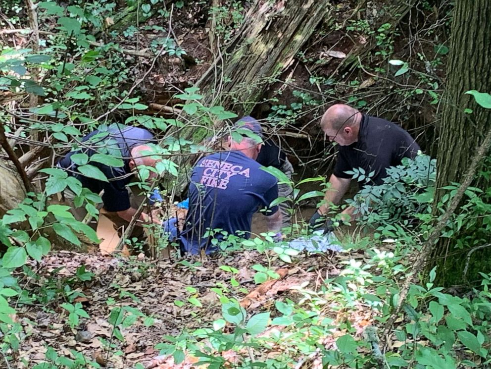 PHOTO: Authorities investigate a scene where officials say a head and torso were found near a creek in Seneca, S.C., on June 24, 2019.