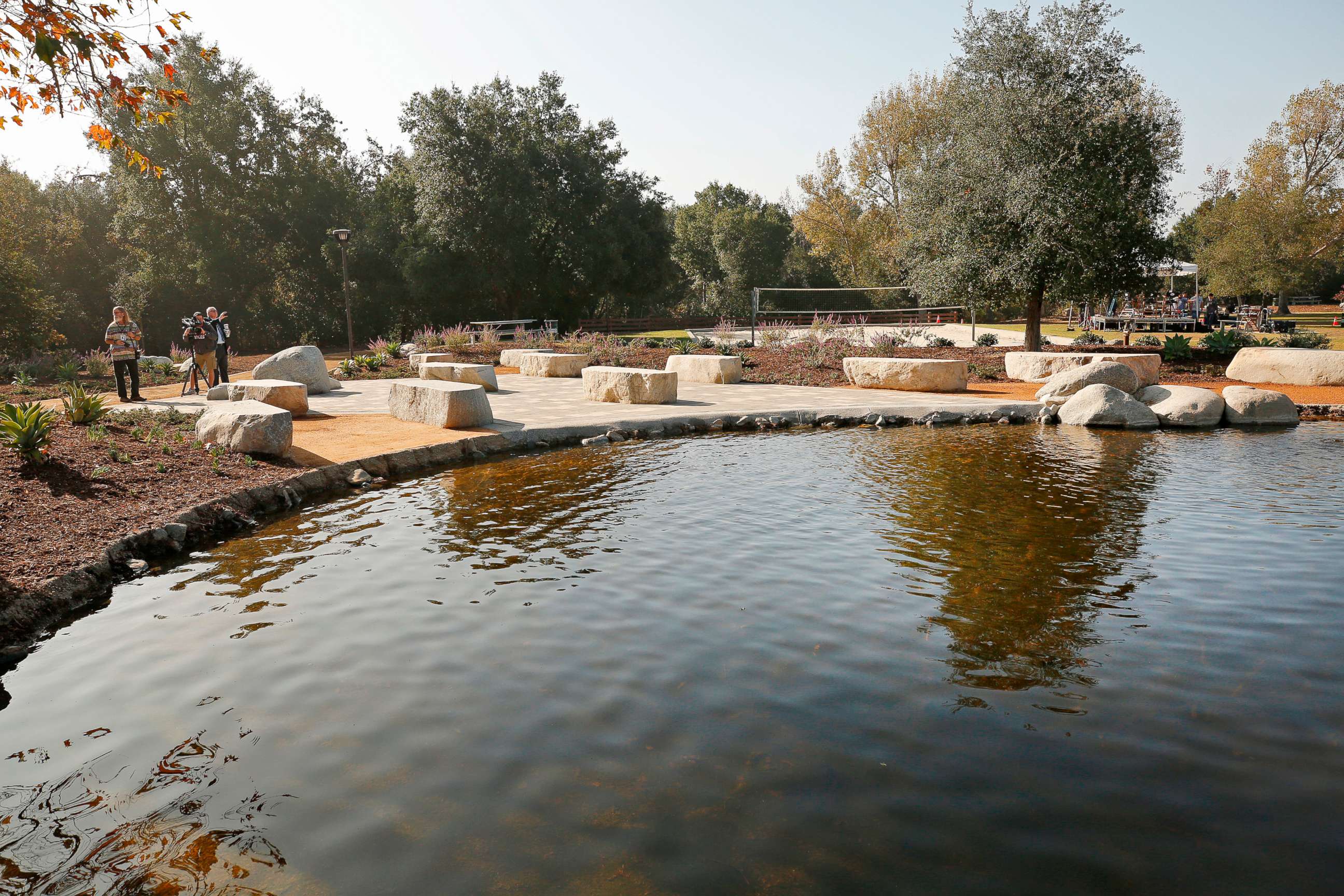 PHOTO: People begin to gather before dedication services at the Healing Garden constructed at Conejo Creek North Park in Thousand Oaks to remember the 12 lives taken and the 248 that survived the Borderline Bar and Grill, Nov. 7, 2019.