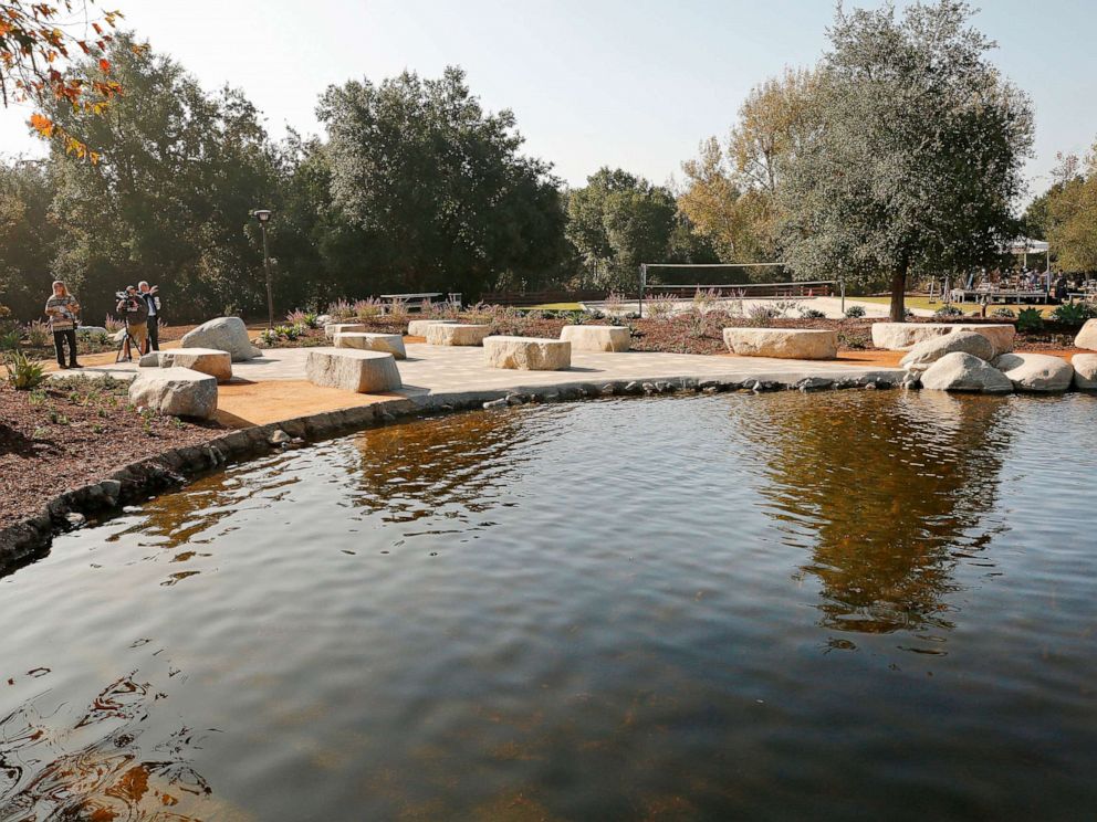 PHOTO: People begin to gather before dedication services at the Healing Garden constructed at Conejo Creek North Park in Thousand Oaks to remember the 12 lives taken and the 248 that survived the Borderline Bar and Grill, Nov. 7, 2019.