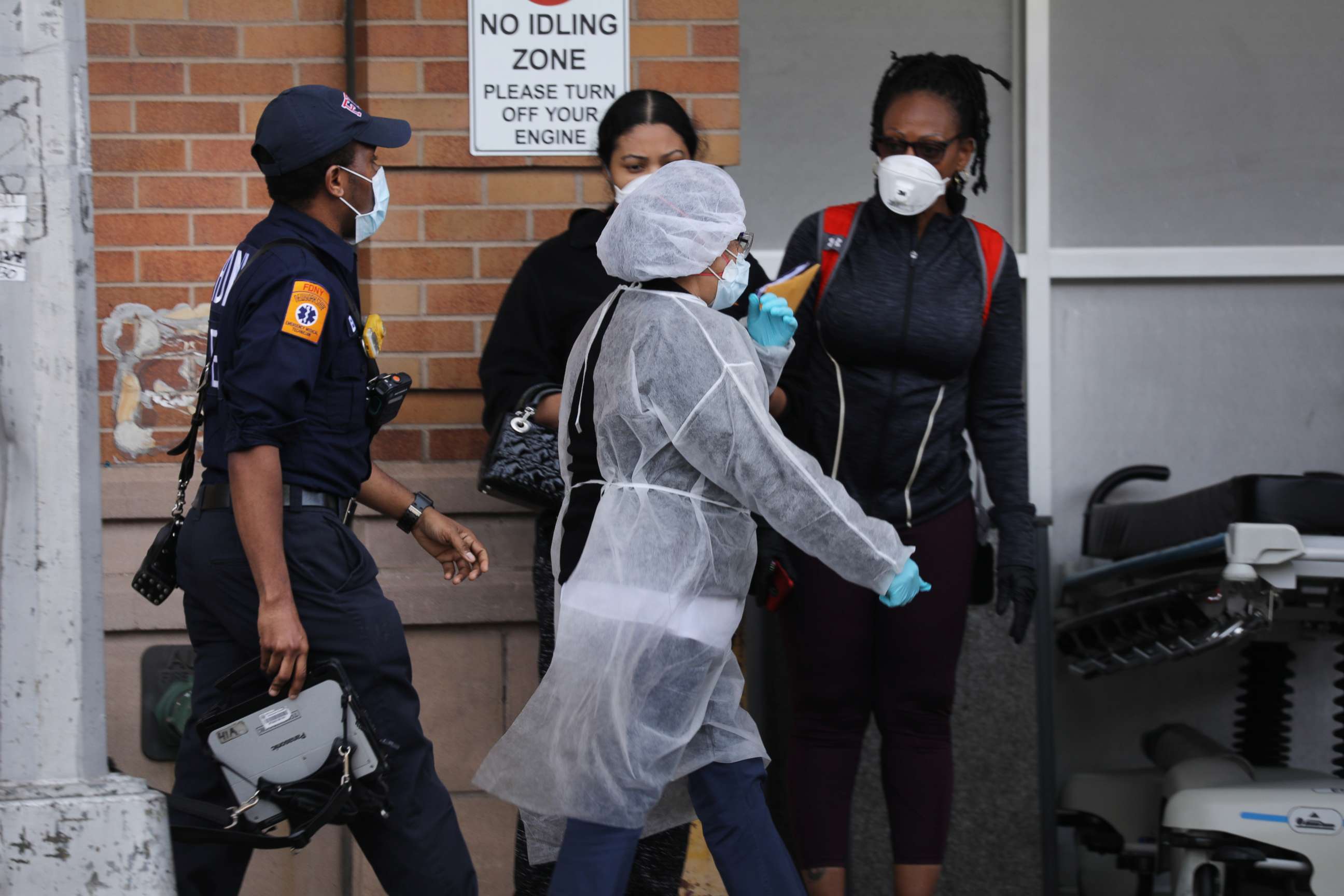 PHOTO: Medical workers take in patients outside a special coronavirus area at Maimonides Medical Center as the U.S. surpasses 100,000 fatalities from COVID-19, May 27, 2020, in New York City.