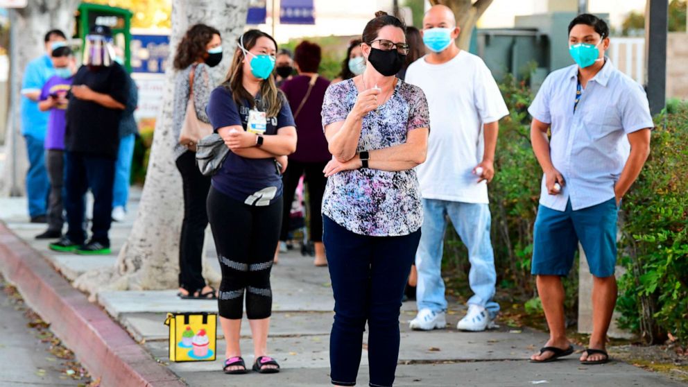 PHOTO: Health care workers and supporters hold a vigil in memory of health care workers who died of COVID-19 in Alhambra, California, on Sept. 1, 2020.