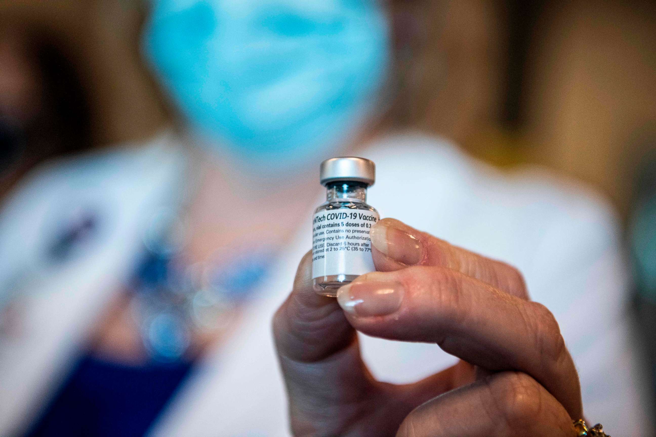 PHOTO: A health care worker holds a vial of the Pfizer/BioNtech COVID-19 vaccine at Memorial Healthcare System in Miramar, Florida, on Dec. 14, 2020.