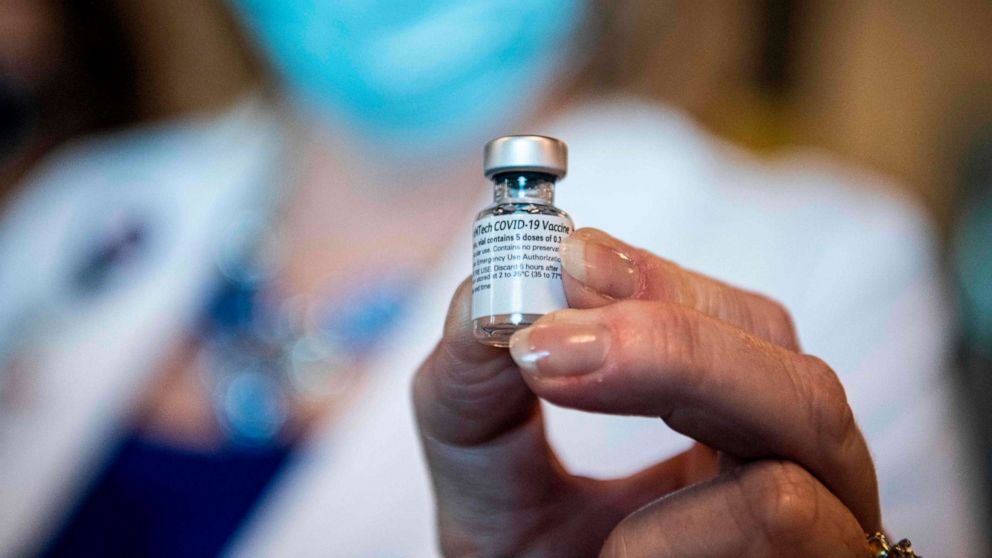 PHOTO: A health care worker holds a vial of the Pfizer/BioNtech COVID-19 vaccine at Memorial Healthcare System in Miramar, Florida, on Dec. 14, 2020.