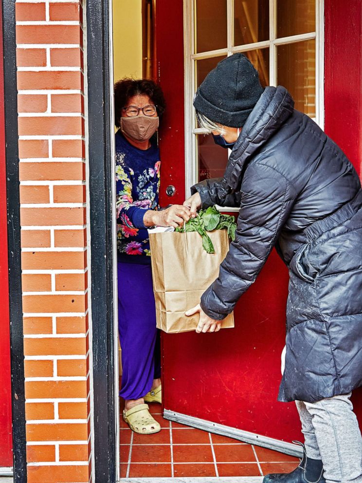 PHOTO: Yin Chang and Moonlynn Tsai deliver meals to seniors in their community amid the COVID-19 pandemic. 