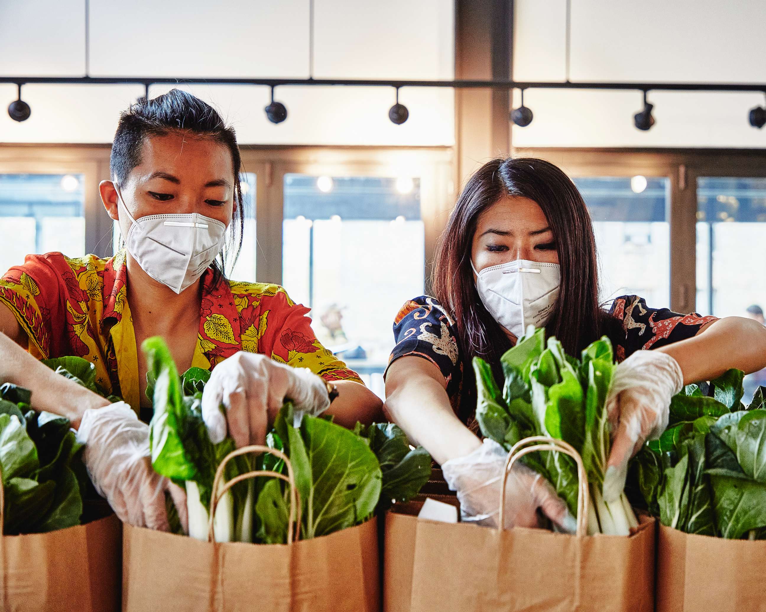 PHOTO: Yin Chang and Moonlynn Tsai deliver meals to seniors in their community amid the COVID-19 pandemic. 
