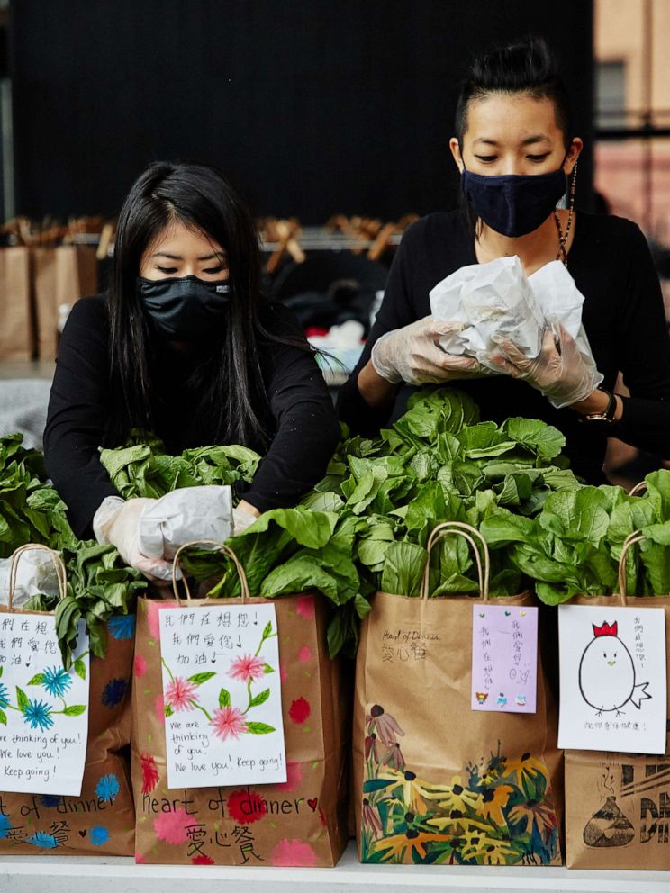 PHOTO: Yin Chang and Moonlynn Tsai deliver meals to seniors in their community amid the COVID-19 pandemic. 