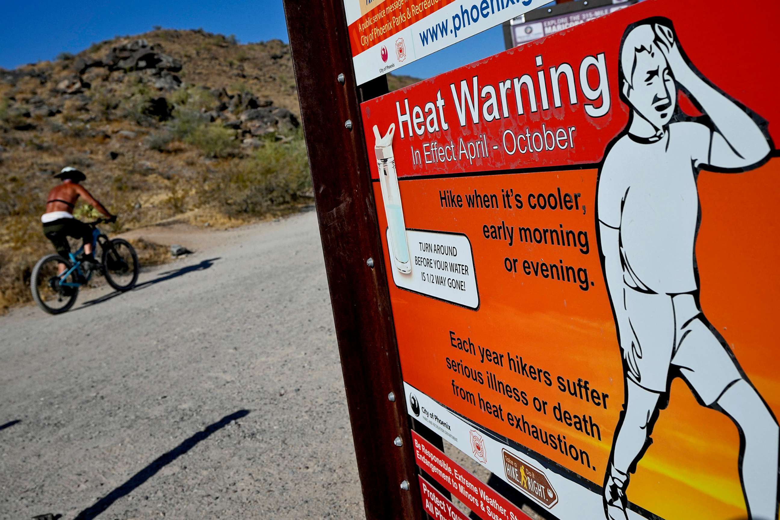 PHOTO: A cyclist finishes his ride early to beat high temperatures, July 10, 2023, in Phoenix.