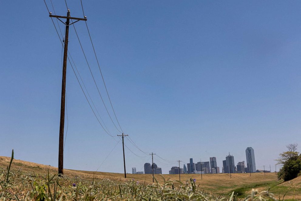 PHOTO: Utility poles lead to downtown Dallas during a heat advisory due to scorching weather in Dallas, Texas, July 12, 2022.