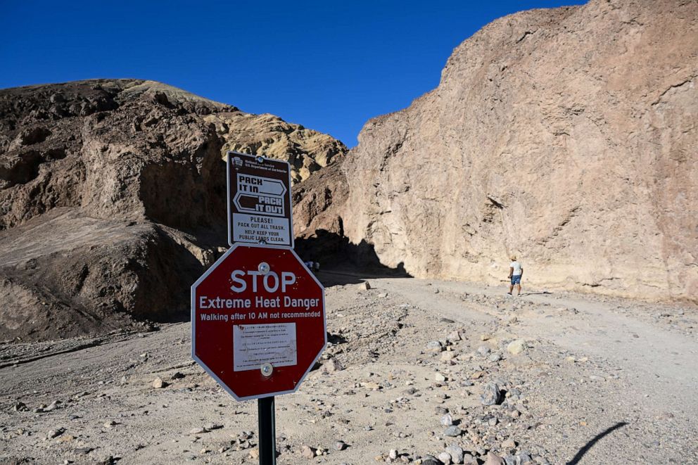 PHOTO: A sign reads 'Extreme Heat Danger' at the Golden Canyon Trailhead, July 9, 2023, as 120 Fahrenheit is expected in Death Valley, Calif.