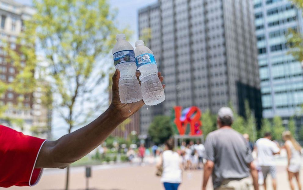   PHOTO: A man sells bottles of water in a sweltering heat July 1, 2018 in Philadelphia 